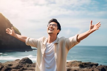 asian men stretch their arms enjoying vacation at the beach - obrazy, fototapety, plakaty
