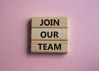 Join our team symbol. Wooden blocks with words Join our team. Beautiful pink background. Business and Join our team concept. Copy space.