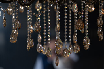 Crystal on a chandelier close-up on a dark background.