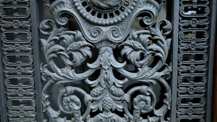 Beautiful adornment by door facade, traditional European ornamentation in building architecture detail close-up