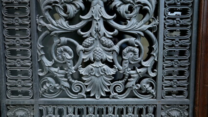 Beautiful adornment by door facade, traditional European ornamentation in building architecture detail close-up
