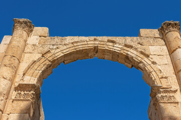 Front view of the Gate South with blue sky in the background at ruins of Jerash. Jordan.