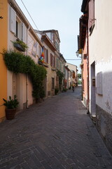 Picturesque mediterranean italian alley in rimini. colorful houses in the town 