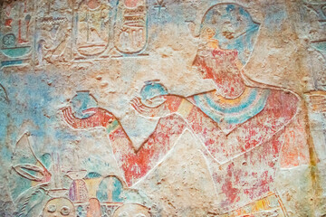 Colorful Egyptian hieroglyphs as an ancient background. Horizontally. 