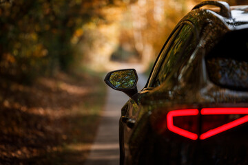 Car on the road during the sunset 
