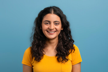 Pretty young indian woman posing on blue background