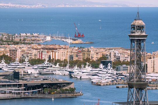 Barcelona's Coastal Elegance: Aeri del Port Tower, Luxury Yachts, and Mediterranean Views
