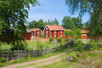 Well preserved old historical hamlet and the surrounding landscape in Stensjo by, Sweden - 677845190