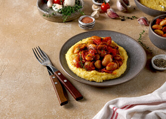 Stew with Butter beans, mushrooms and tomato sauce served with polenta, vegetarian dish
