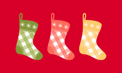Clipart set with Christmas plaid stockings on isolated red background. Holiday design for Christmas home decor, holiday greetings, Christmas and New Year celebration. 