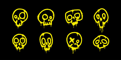 Spray paint. Abstract yellow skulls with paint drips on a black background. Skeleton head silhouette set in grunge style. Street art isolated elements. Graffiti or tattoo concept. Vector illustration. © Mirco Emmy