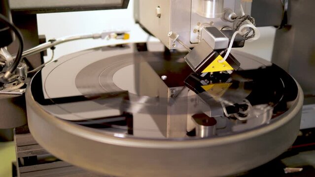 Machine writing a Vinyl LP for further processing in the audio factory