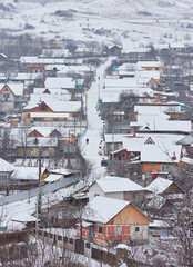 winter landscape with country houses covered with snow