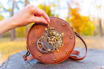 Adjusting Clock Hands on a Circle Bag in the Forest