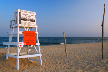 A lifeguard chair stands empty at the end of a summer vacation day on Georgica Beach, East Hampton, one of the many beautiful beaches on the Hamptons