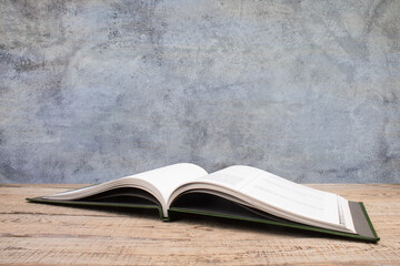 open book, books on the gray concrete background. Back to school. Education. Copy space for text.