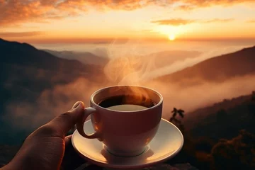 Photo sur Plexiglas Mont Cradle A hand cradling a cup of coffee, its delightful aroma set against a scenic background