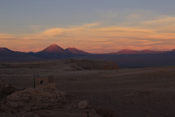 Wide shot of the sunset over the Licancabur Volcano in Bolivia.