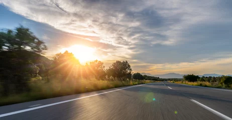 Foto auf Acrylglas Mediterranean sea coast road into mountains horizon in summer with beautiful bright sun rays © AA+W
