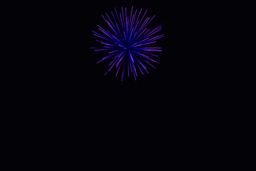 Fototapeta premium New Year's Night, Diwali, bonfire night Colourful Starbursts and Rocket Explosions on Black Background Sky with Red, Green, Blue, Purple, Gold Colour Fireworks Bursts with Space for Text-Smoke-free