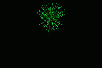 Fototapeta premium New Year's Night, Diwali, bonfire night Colourful Starbursts and Rocket Explosions on Black Background Sky with Red, Green, Blue, Purple, Gold Colour Fireworks Bursts with Space for Text-Smoke-free