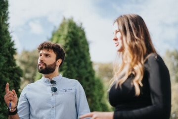University students study together, discussing subjects and helping each other prepare for exams. Enjoying a sunny day in the park, their teamwork leads to successful results.