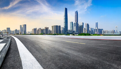 race track road and city skyline with modern buildings scenery in guangzhou guangdong province china panoramic view