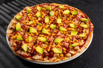 BBQ chicken pizza - Neapolitan sauce and cheese base. Fusion of chicken, bacon, corn, avocado with BBQ sauce