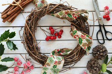 Making a DIY Christmas grapevine wreath with craft supplies