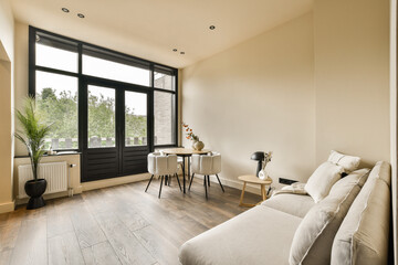 a living room with wood flooring and large windows looking out onto the cityscapearrons com - obrazy, fototapety, plakaty