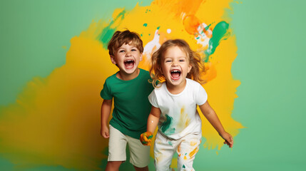 cheerful children, boy and girl on a colored background in the studio, brother and sister, child, kid, toddler, childhood, portrait, face, emotional, expression, joy, friends, happiness, baby, clothes - obrazy, fototapety, plakaty