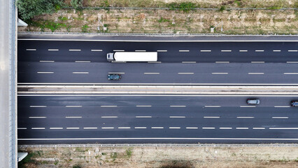 Aerial view of asphalt road with the rural area on both sides, the intercity highway was...