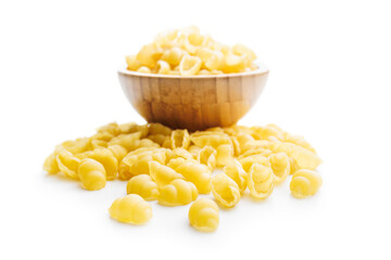 Uncooked gnocchi pasta. Raw italian pasta in bowl isolated on white background.