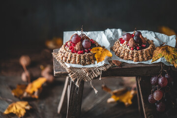 Breakfast Granola Tarts with Nuts, Chocolate, pomegranate and Grapes