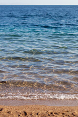 Fototapeta na wymiar Beautiful view of a clear sea with small waves on a sunny day