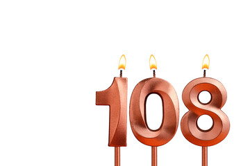 Birthday candle number 108 on white background