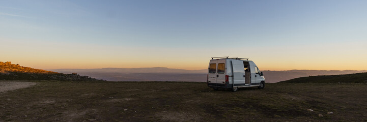 Panorama of Serra da Arada over mountain landscape at evening sunset with camper van on road trip, Sao Pedro do Sul, Portugal - obrazy, fototapety, plakaty