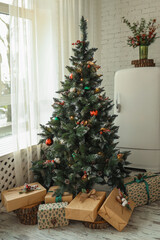 Fototapeta na wymiar Christmas gift with a green bow under the Christmas tree