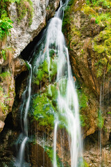 waterfall with flowing water in the mountain