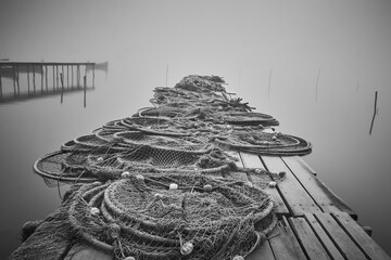fishing nets on the shore of the lake