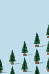 Christmas decoration tree on pastel blue background. Minimal holiday pattern.