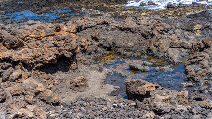 ocean waves breaking on secluded rocky cove
