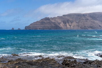 Fototapeta na wymiar View of la famara cliffs from la graciosa island canary spain