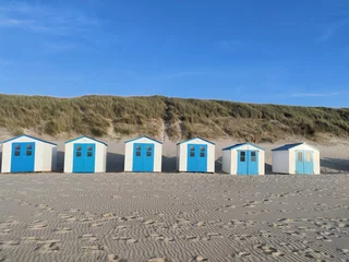 Gordijnen Cute white cottages by the beach, small beach huts, paradise beach, water sports  © Thomas