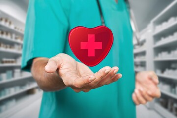 Doctor holding red heart. Healthcare concept