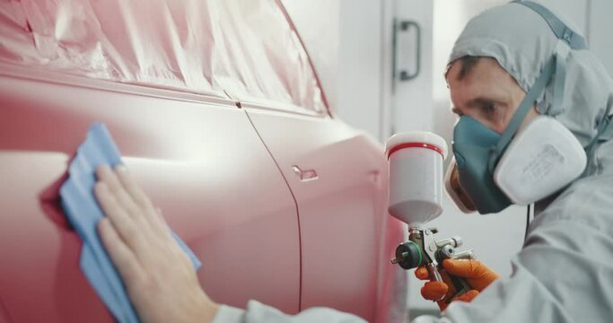 Car Painting Procedure at Auto Service Store. Automotive Paint Services, Quality Auto Body Shop Concept. Car Painting in Chamber. Automobile Repair. Coating of Car Body Elements