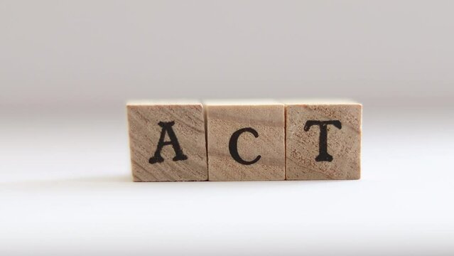 Letters spelling ACT are spelled as hand drops the T