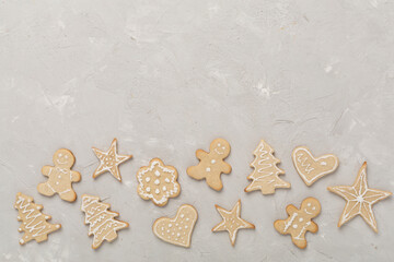 Fototapeta na wymiar Cute homemade Christmas cookies on concrete background,top view