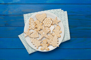 Cute homemade Christmas cookies on wooden background,top view