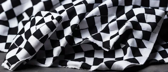 Gordijnen Blue and white checkered folded cloth on plain black background from Generative AI © Arceli